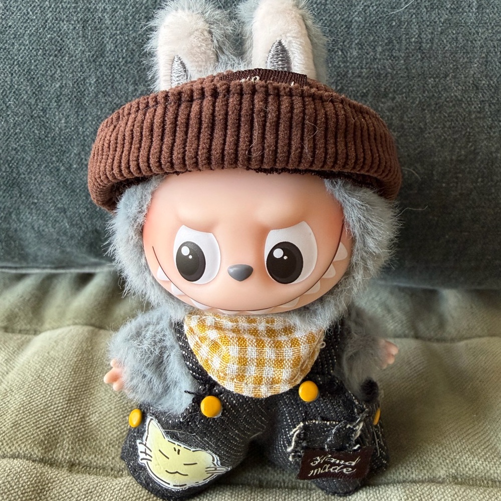 Labubu ( Mini) denim overalls with brown hat and yellow scarf.